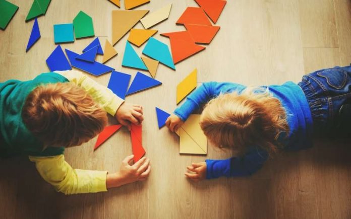 kids playing with puzzle, education and learning concept